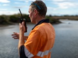 Man using radio from the back