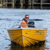 Yellow boat driving towards ramp