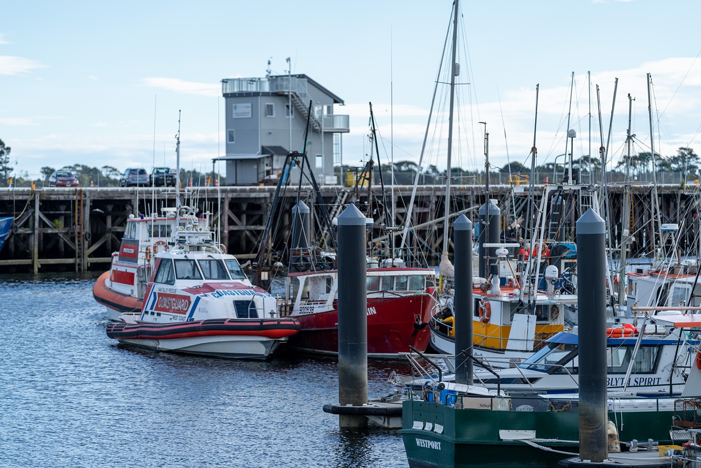 Wharf with fishing boats in front